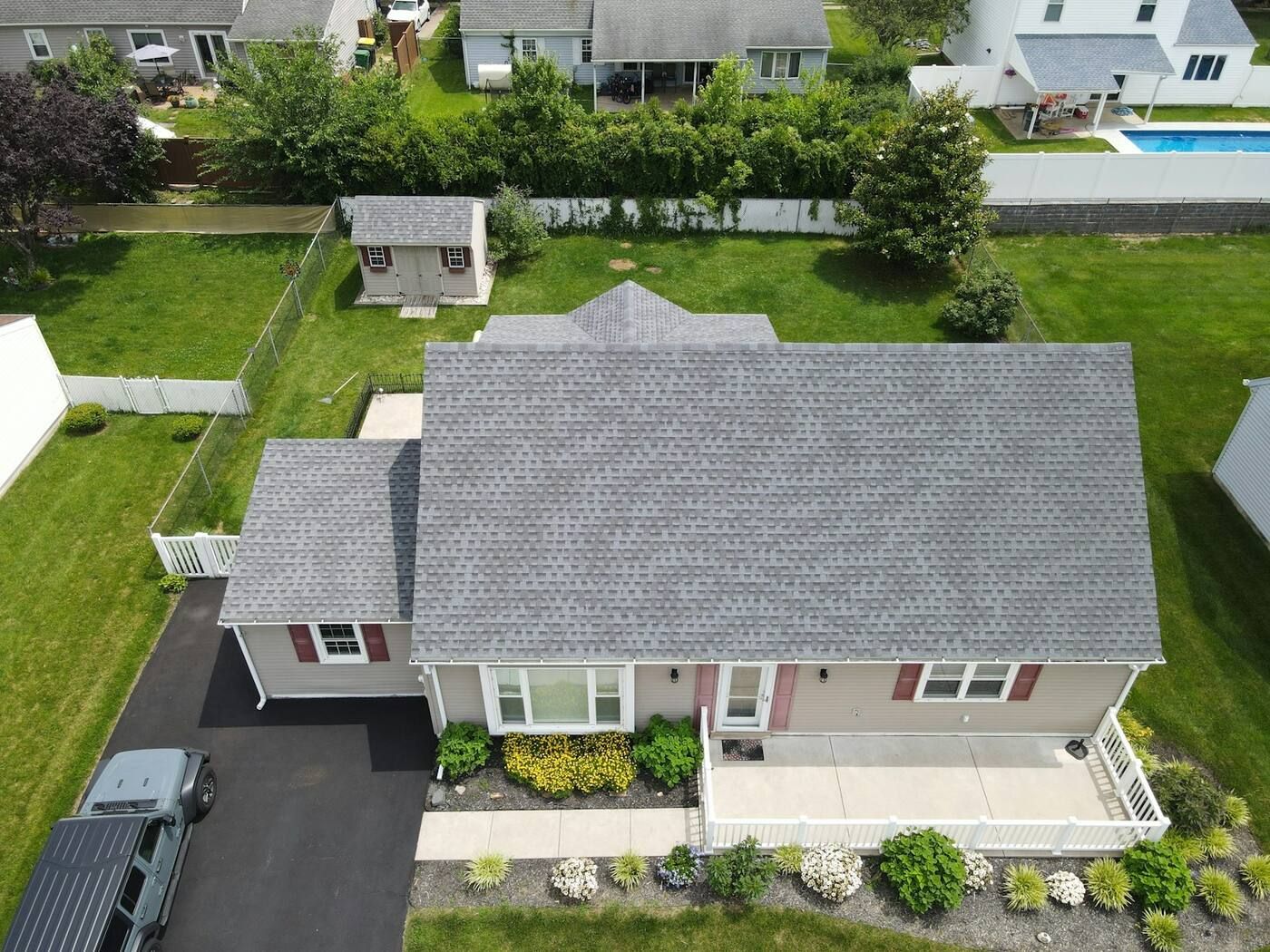 After: a finished gray architectural shingle roof seen from above